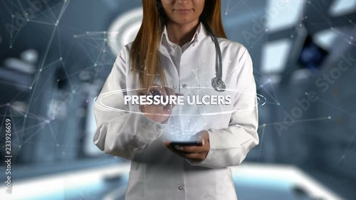 Female Doctor Hologram Word Pressure ulcers photo