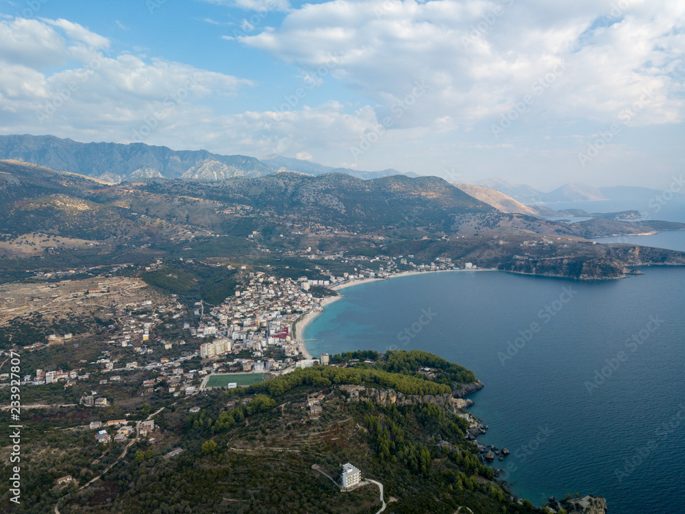 Obraz premium Aerial view of Himara, Albania in autumn. Beautiful beach town along the Albanian Riviera