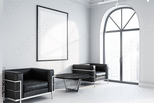Office waiting room, black armchairs, poster side