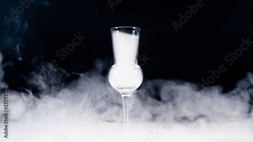 Leinwand Poster schnaps glass full of smoke, shot glas filled with smoke