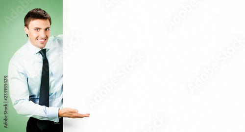 Businessman showing blank signboard