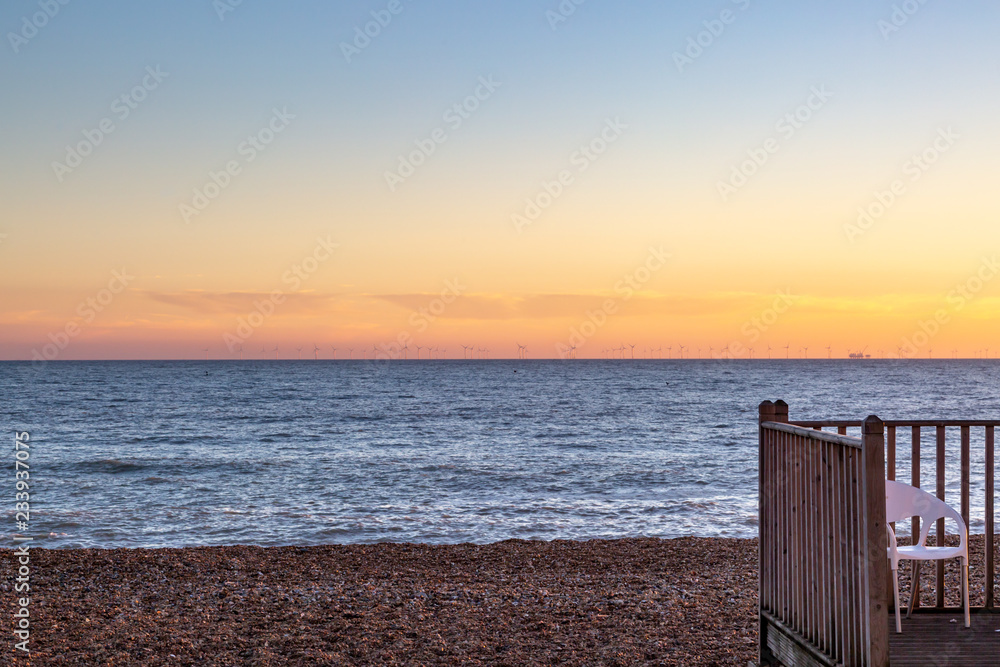 Part of a decked area on Brighton Beach, at Sunset Part of a decked area on Brighton Beach, at Sunset