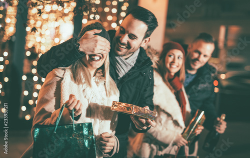 Man Giving Woman A Christmas Surprise