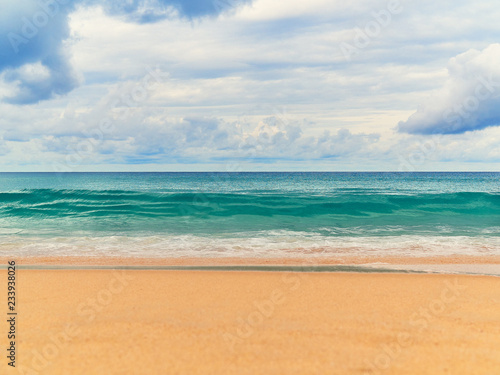 Fototapeta Naklejka Na Ścianę i Meble -  View of the paradise beach with golden sand, waves on the sea and the sky with clouds