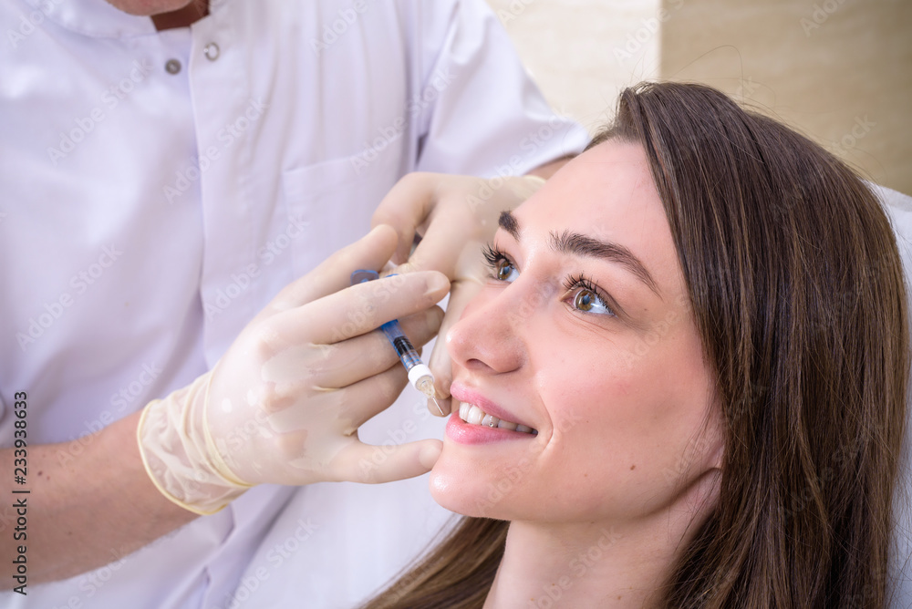 Hardware cosmetology, mesotherapy, Close up of young woman getting treatment of cheek zone at spa Hardware cosmetology, mesotherapy, Close up of young woman getting treatment of cheek zone at spa
