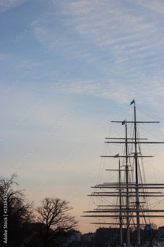 mast of a ship with blue sky