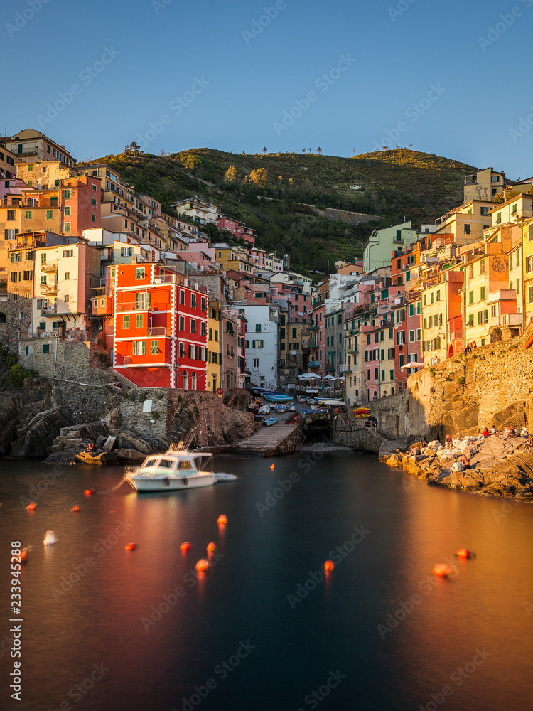 Riomaggiore at sunset. It is the most southern village of the five Cinque Terre towns. Liguria, Italy.