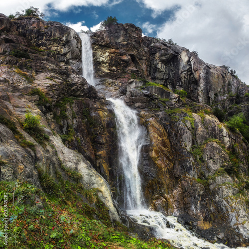 mountain waterfall from Ushba glasier river Georgia Svaneti