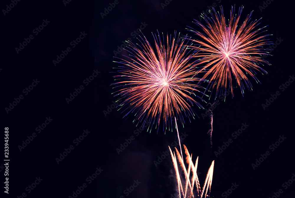 Colorful firework dark sky background with copy space