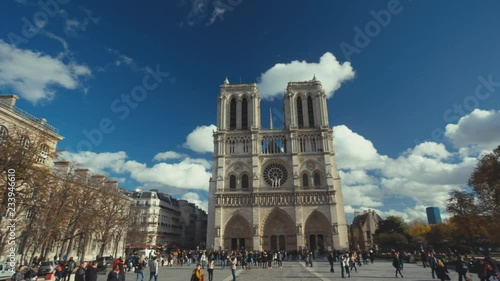 Panning establishing shot of the famous Notre Dame Church in Paris.