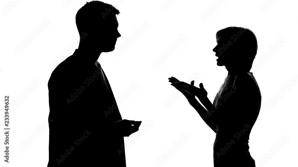 Silhouettes of male and female arguing and quarrelling, relations and conflict