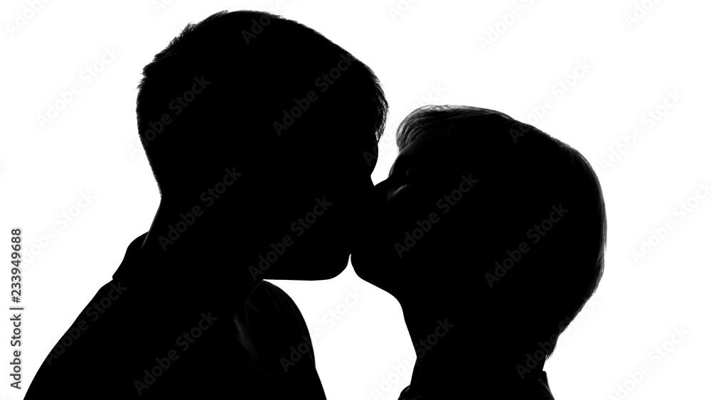 Shadows of young lady and man kissing on romantic date, love passion, tenderness