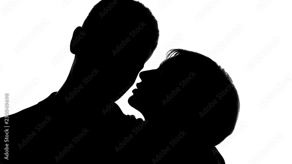 Young lady whispering love words into males ear, tender behavior, flirting