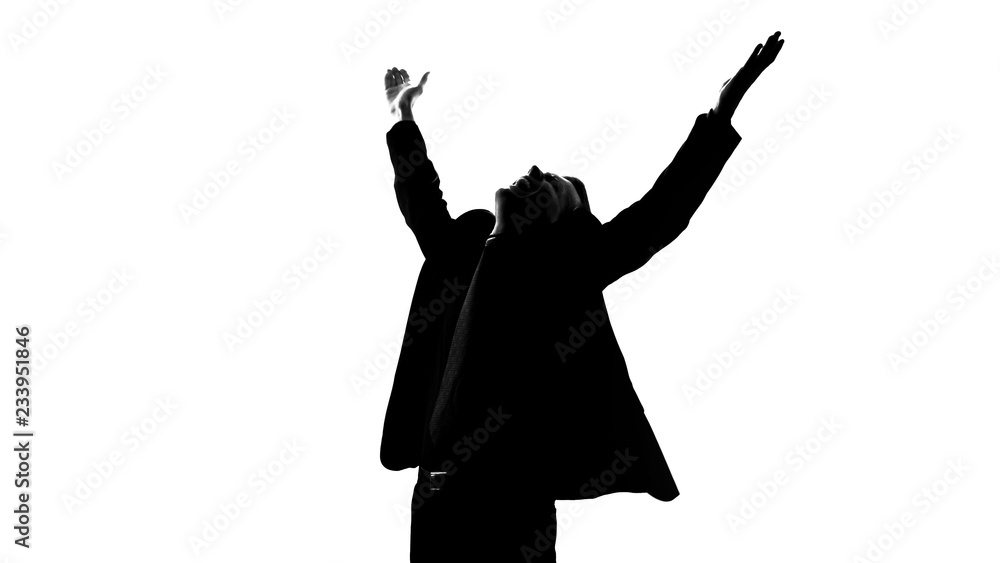 Man in suit raising hands full of happiness, got lucky, successful startup