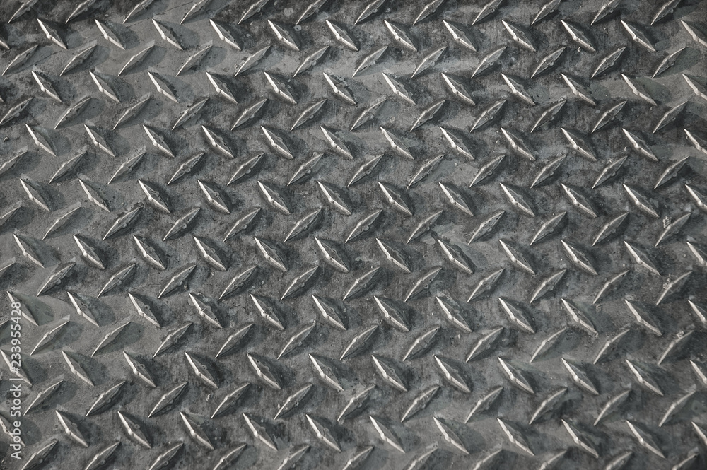 Abstract metal background with repeating diamond pattern. Abstract metal background with repeating diamond pattern.
