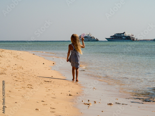 Wallpaper Mural young woman walking on the beach Torontodigital.ca