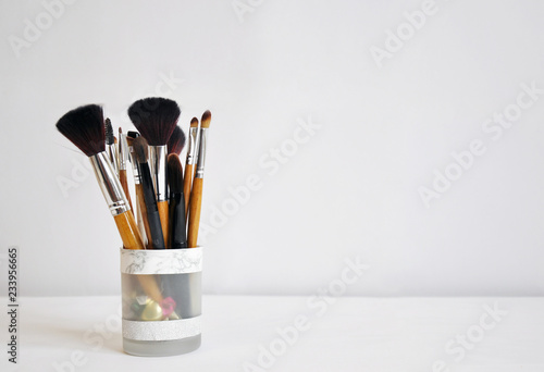set of makeup brushes on white background