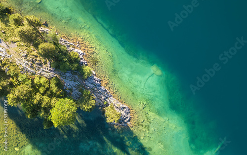 Aerial view on the lake and forest. Natural landscape from drone. Aerial landscape from air in the Switzerland