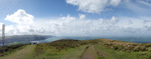 View from Selworthy Beacon, England UK near Exmoor and west of Minehead on the south west coast path with purple heather