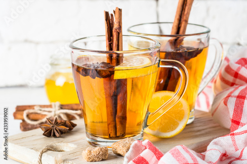 Autumn hot tea with lemon honey and spices