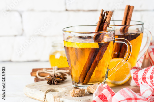 Autumn hot tea with lemon honey and spices