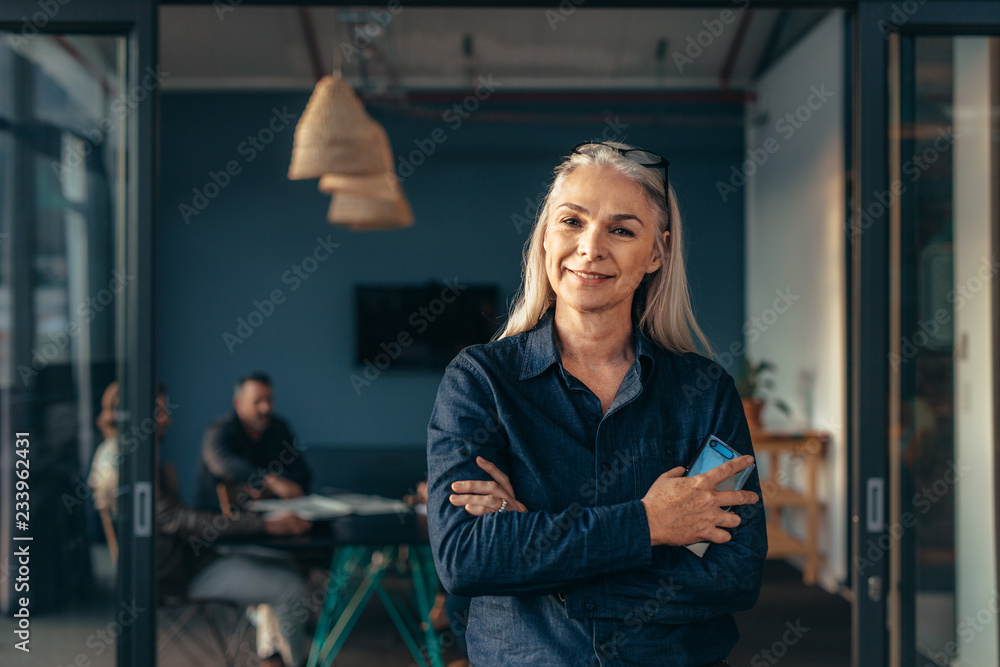 Fototapeta premium Smiling senior business woman at office