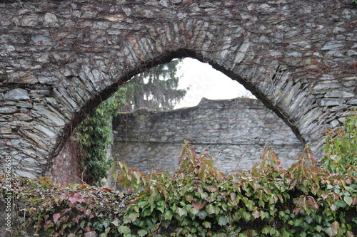 Brick archway with green plants