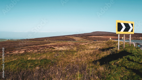 Fotografie Road sign indicating a sharp deviation on the A537 in the beautiful Peak District between Buxton and Macclesfield in Derbyshire, England