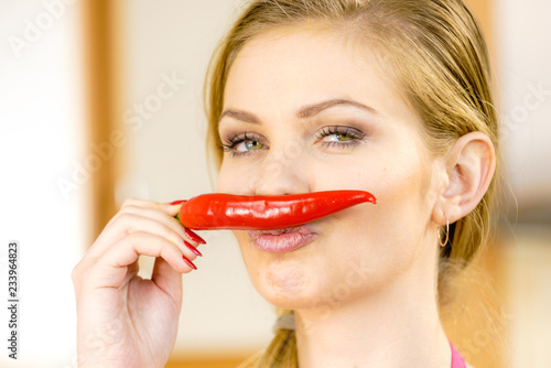 Woman holding chilli hot pepper