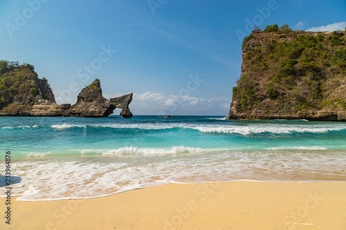 Magnificent view of unique natural rocks and cliffs formation in beautiful beach known as Atuh Beach located in the east side of Nusa Penida Island, Bali, Indonesia. © umike_foto