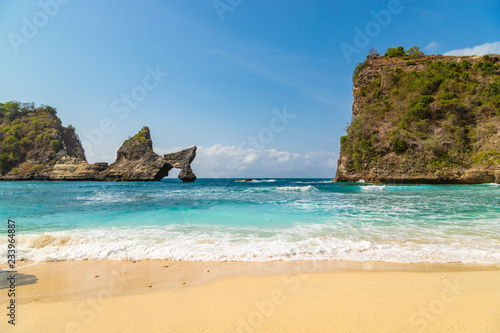 Magnificent view of unique natural rocks and cliffs formation in beautiful beach known as Atuh Beach located in the east side of Nusa Penida Island, Bali, Indonesia. © umike_foto