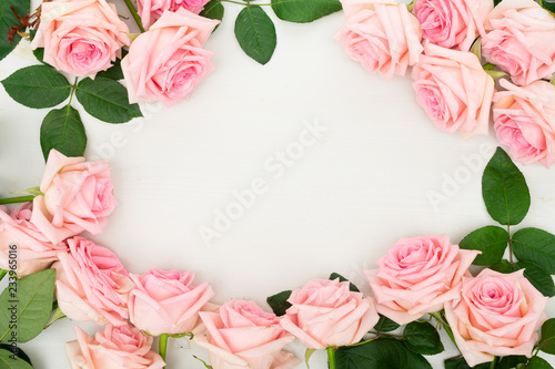 Wallpaper Mural Rose fresh natural flowers frame on table, top view with copy space, flat lay scene Torontodigital.ca