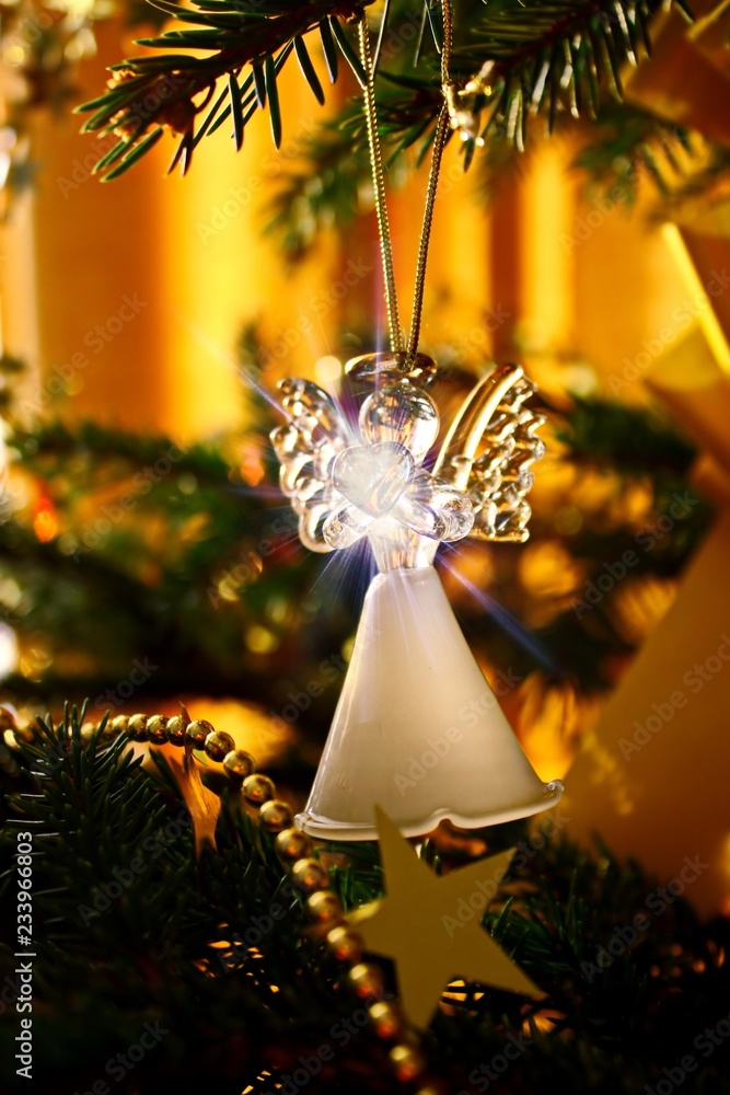 Toy glass angel decoration on the Christmas tree