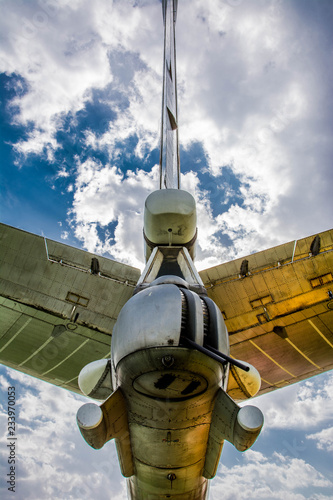 Closeup side view of old soviet civil propeller airliner/ Russian turboprop old aircraft parking at the airport/ Reconnaissance aircraft of the navy photo