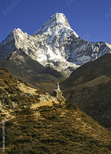 Fototapeta Naklejka Na Ścianę i Meble -  Ama Dablam Mountain and Buddhist Stupa Vertical Landscape View on Hiking and Trekking Trail to Everest Base Camp in Nepal Himalaya Mountains