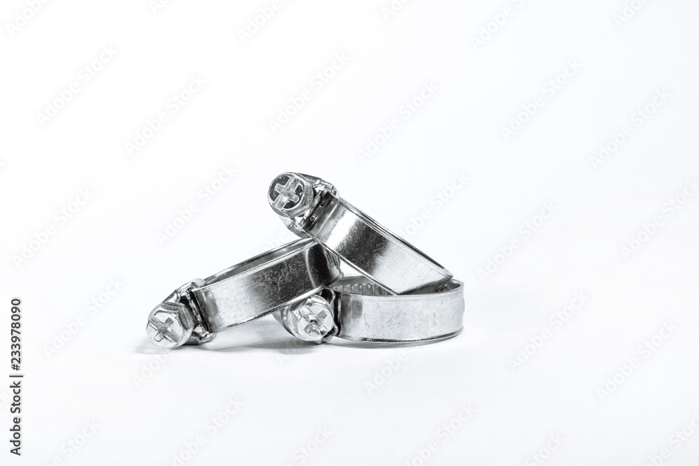 New metal hose clamps with threaded connection for pipes, stainless steel, small size on isolated white background close-up New metal hose clamps with threaded connection for pipes, stainless steel, small size on isolated white background close-up