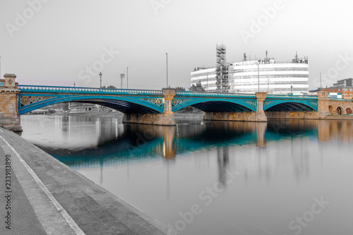 Obraz na plátně Long Exposure of Bridge in Nottingham, UK, with reflecting lights and embankment