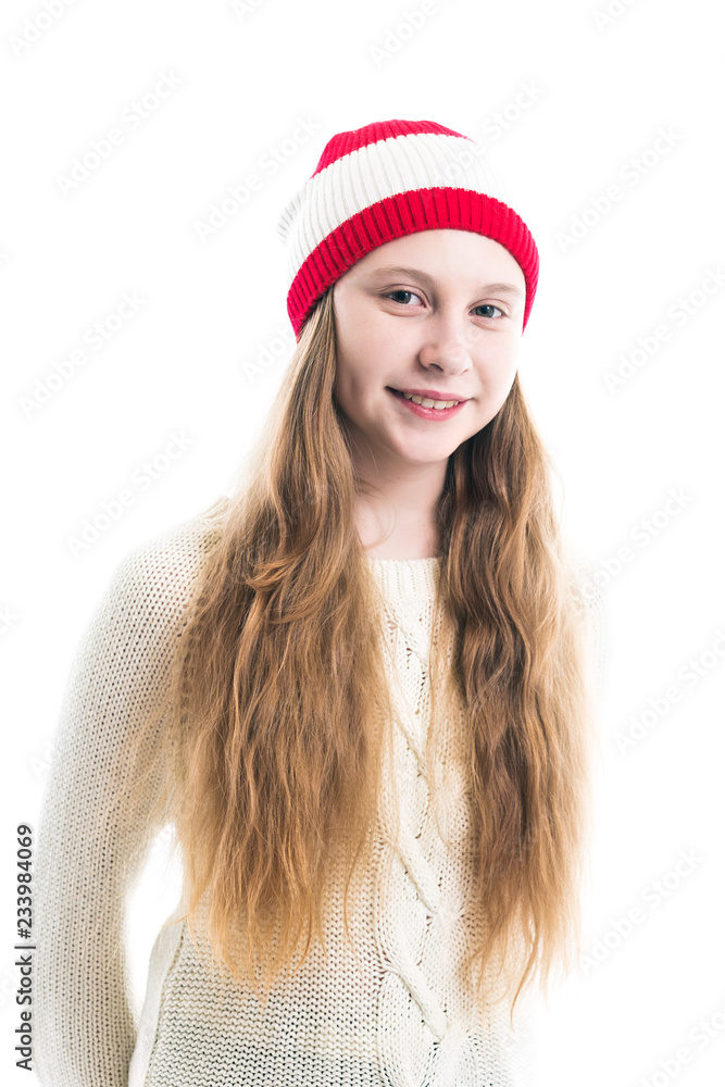 Happiness winter holidays christmas. Teenager concept - smiling young woman in red hat, scarf and over white background. Happiness winter holidays christmas. Teenager concept - smiling young woman in red hat, scarf and over white background.
