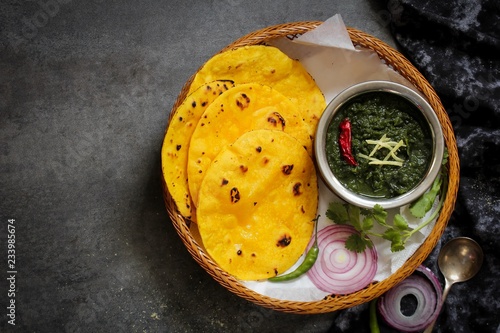 Sarson ka saag and Makki ki roti /Indian corn bread with mustard leaves gravy photo