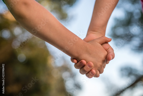 Kids holding hands together