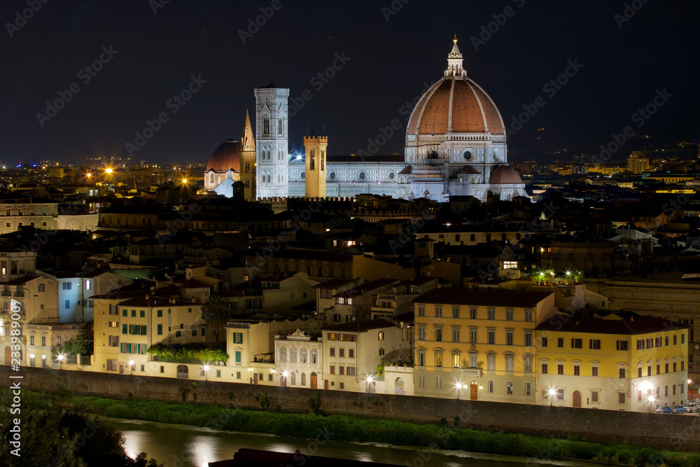 Night view of The Florence Cathedral, Duomo di Firenze, Cattedrale di Santa Maria del Fiore and the Lungarno in Florence Italy