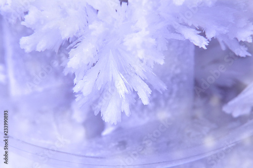 Beautiful crystal or snowflake. Christmas or New Year, greeting cards, background. Selective focus, blur, closeup, macro.