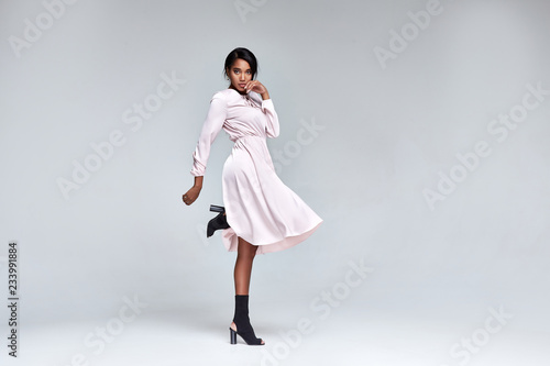 Beautiful sexy lady fashion pretty woman model pose wear summer collection clothes style for party walk skin dark hair glamour accessory dress cosmetic background studio designer silk dress.
