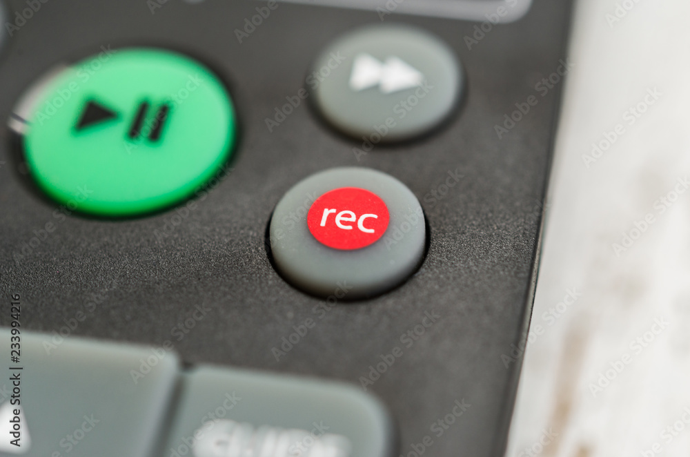 Close up macro photography of a smart tv television remote control with  recording button. Concept of show, business, recording, tv, action, and  radio Stock Photo