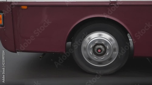 Passing big motorhome on wet highway. Water drops. Front of vehicle.