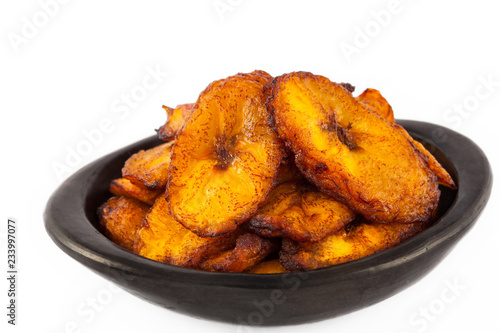 Quadro su tela Deep fried ripe plantain slices isolated in white background