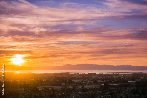 Sunset view of Hayward and Union City from Garin Dry Creek Pioneer Regional Park  east San Francisco bay shoreline and San Mateo bridge in the background  California