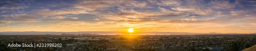 Expansive sunset panorama comprising the cities of east San Francisco bay, Fremont, Hayward and Union City, California