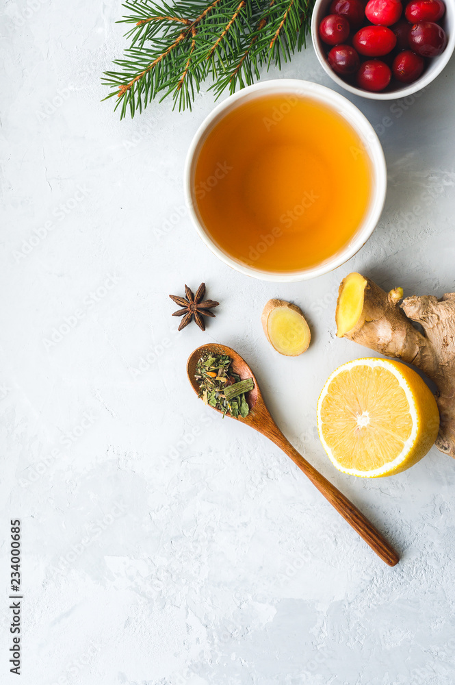 Herbal tea for colds and flu. Healthy beverage made from lemon, ginger, spices and herbs. Vertical photo. Herbal tea for colds and flu. Healthy beverage made from lemon, ginger, spices and herbs. Vertical photo.