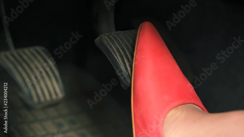         4K.Woman In Red High Heels Shoes Pressing Car Pedals